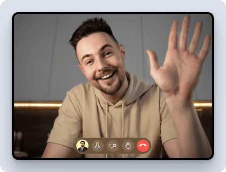 Kickoff video call with a smiling teammate waving on screen